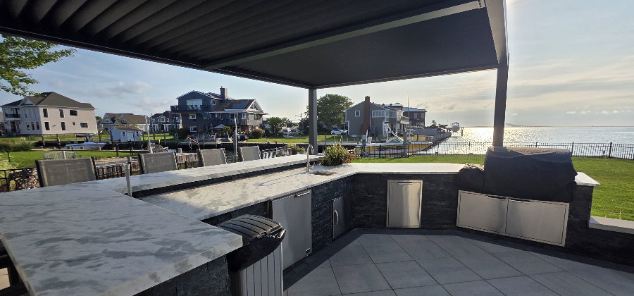 outdoor kitchen with pergola and MSI stacked stone coal canyon
